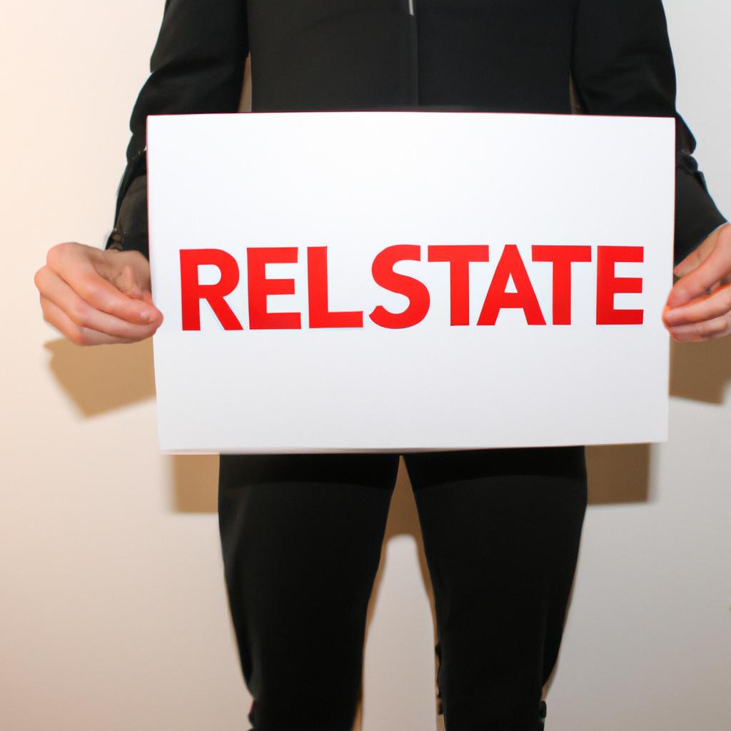 Person holding real estate sign